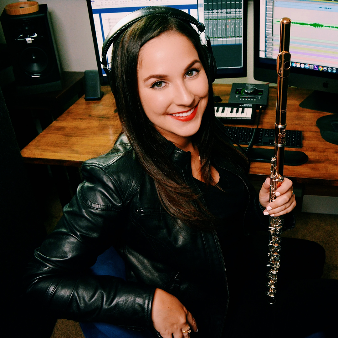 Photo of flautist Gina Luciani in her studio.