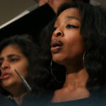 A singer performs with the Oriana Choir