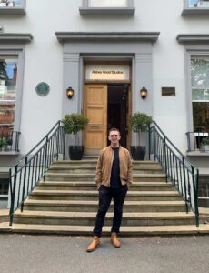 A music student standing outside of Abbey Road Studios in London.