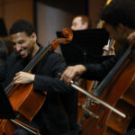 Two cellists perform with the Thornton Chamber Orchestra