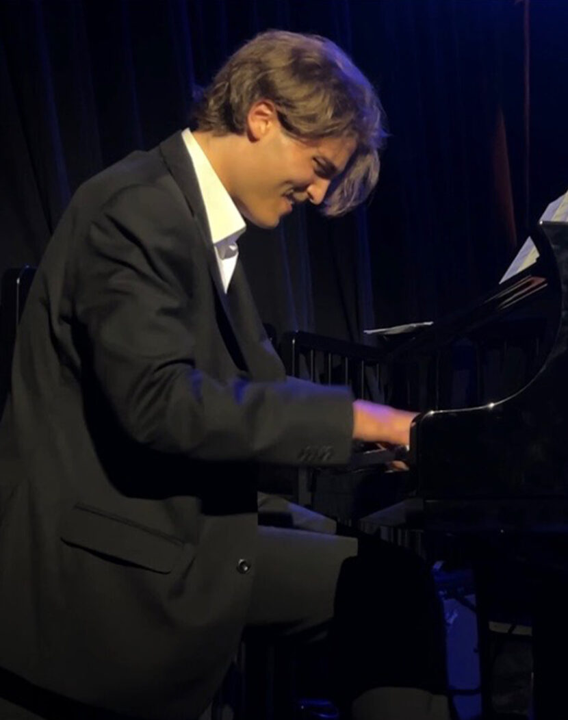 Photo of a student pianist performing on stage.