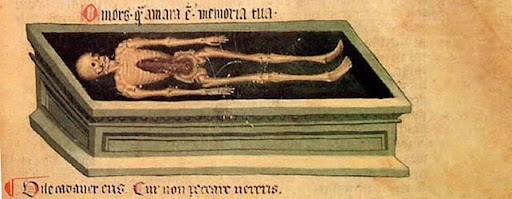 An image of a skeleton in a stone tomb