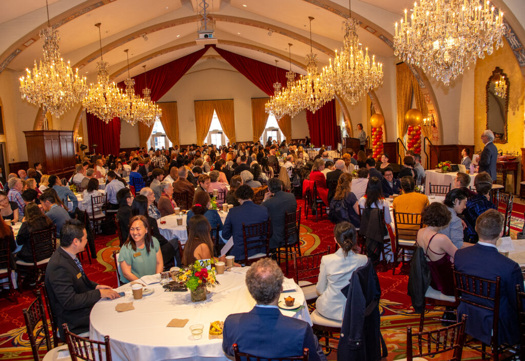 An indoor ballroom full of people.