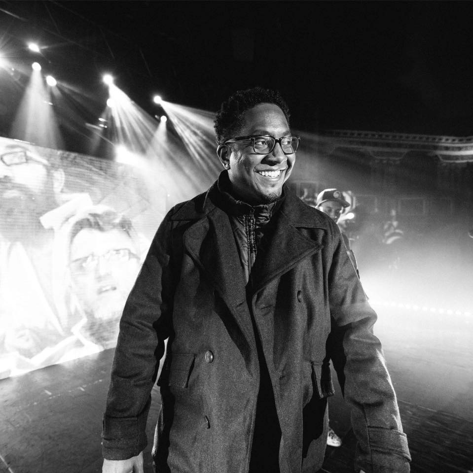 Kevin Randolph surrounded by concert strobe lights.