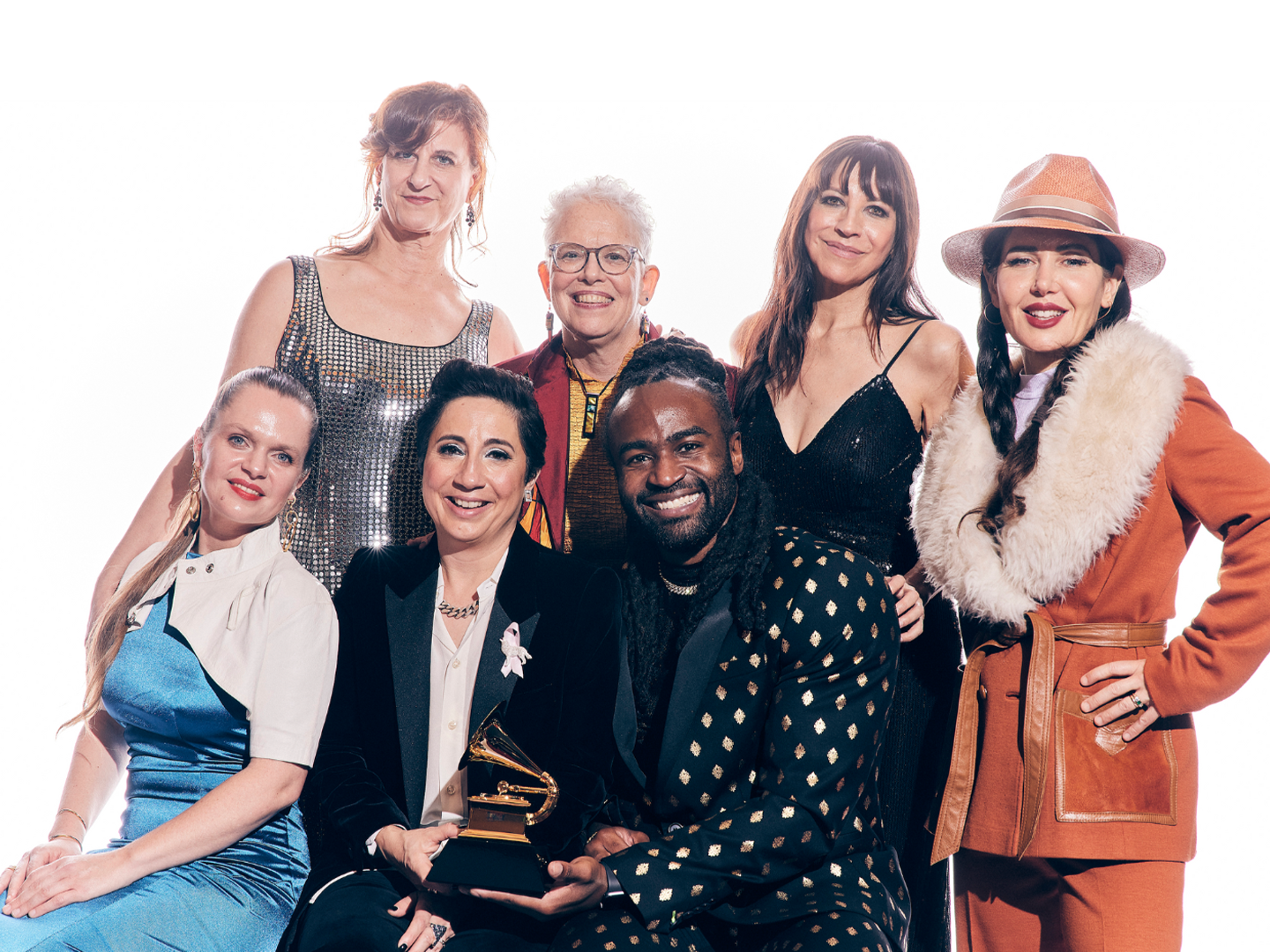 vocal group Tonality poses for a photo, holding their Grammy award 