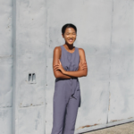 Composer Yasna Vismale stands and smiles.