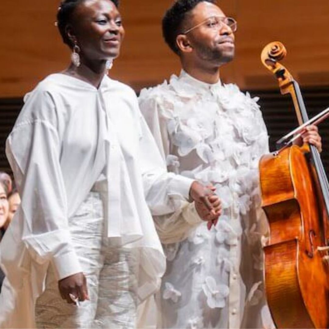 Nathalie Joachim and Seth Parker Woods on stage with the New York Philharmonic.