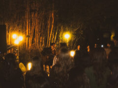 Young student performs to audience in outdoor venue.