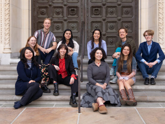 Officers from the Thornton Student Council sit on steps