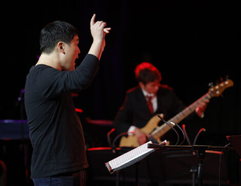 Bandleader Jon Hatamiya conducts the Concert Jazz Orchestra.