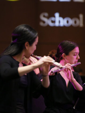 Flute players perform at a USC Thornton Winds concert.