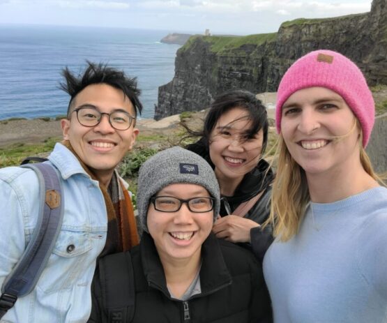 Four USC Thornton students pose for a photo on the Irish cliffside.