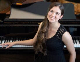 Composer Grace Miedziak at the piano.