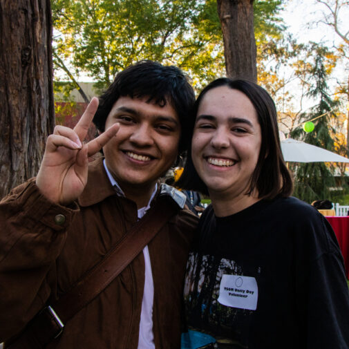 Two students outdoors at Unity Day demonstrating the USC 