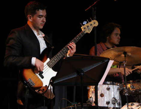 Guitarist and drummer perform onstage at USC.