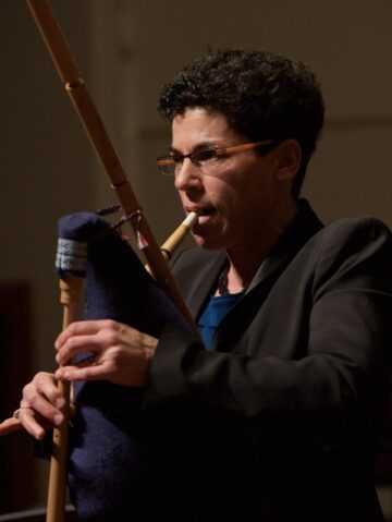 Rotem Gilbert performs on an early music instrument.