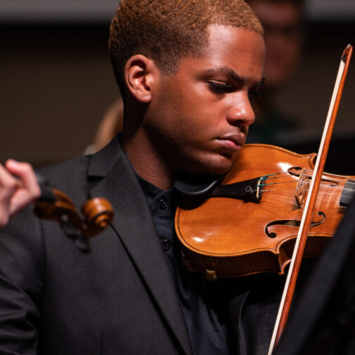 String student performs at a concert.