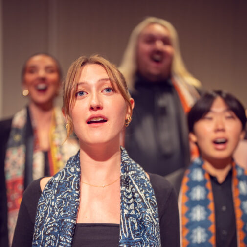 quartet of choristers perform onstage