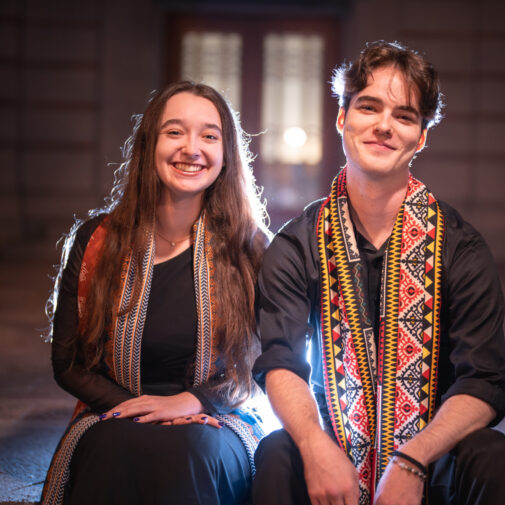 Two choristers smile for the camera.