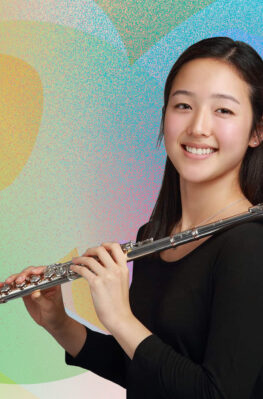 Jamie Kim holding a flute and smiling in front of a colorful illustrated background.