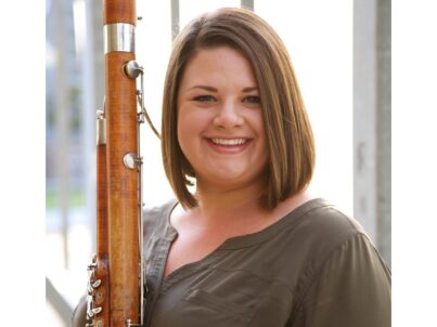 Image of woman holding a bassoon.